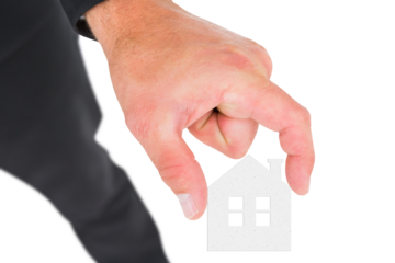 Digital png photo of caucasian businessman holding house model on transparent background