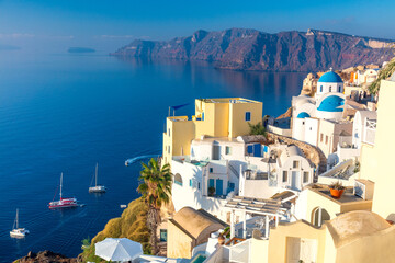 view of Santorini, Greece. White architecture, yachts and the blue sea of the island of Santorini against the background of the sea.