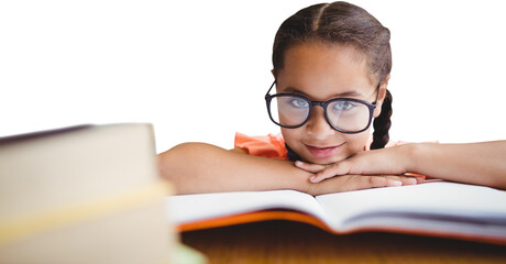 Digital png photo of happy caucasian girl wearing glasses lying on books on transparent background