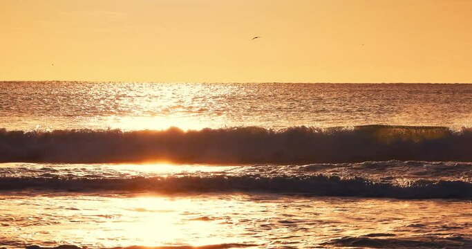 Golden sunrise over ocean beach shore. beautiful morning sea horizon