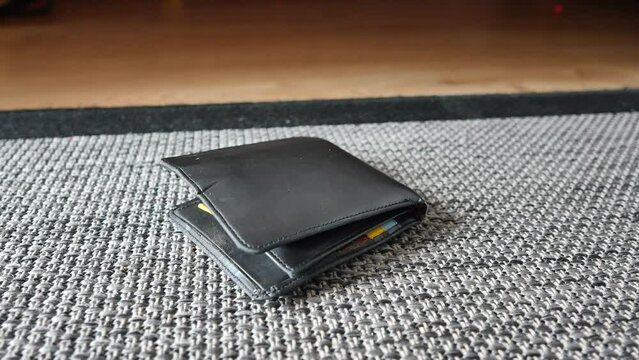 left wallet on floor at home 