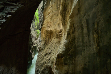 Small river running in narrow canyon in Aareschlucht in Switzerland