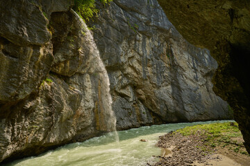 Small waterfall and river in canyon, Aareschlucht in Switzerland