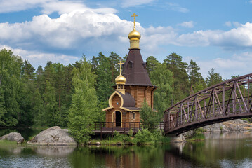 View of the wooden church of St. Andrew the First-Called on the river Vuoksa on a June afternoon....
