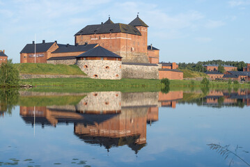 Naklejka na ściany i meble View of the ancient fortress of the city of Hameenlinna on a June afternoon