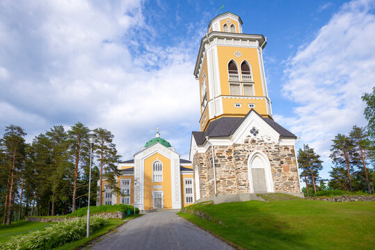 View of the belfry and the famous wooden church on a sunny June day. Kerimaki, Finland