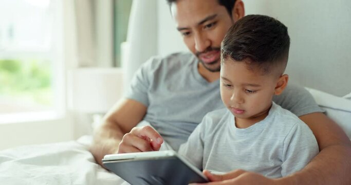Dad, kid or tablet in bedroom for games, online learning or streaming multimedia website. Man, father and boy child relax in morning on digital technology, watching cartoon or movies together at home