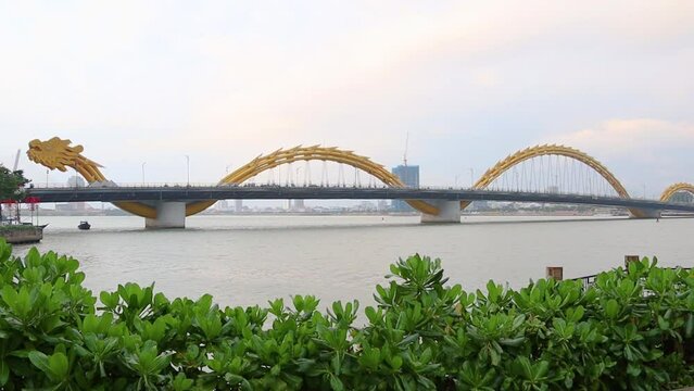 The view of Carp Dragon Statue and Dragon Bridge (Da Nang) over the Han River  at Da Nang, Vietnam.