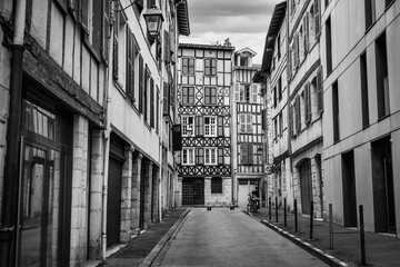 Narrow alley with very old architecture in the French Basque country, Bayonne.