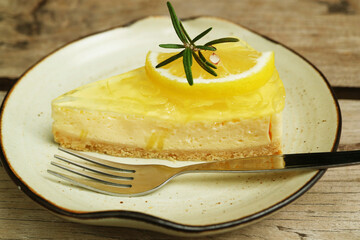 Closeup of a slice of mouthwatering sweet and tart lemon cream cheese pie on a white plate