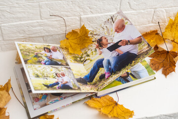 dry autumn leaves and a photo album
