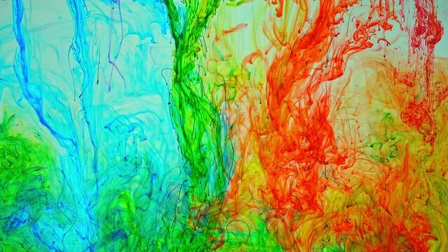 .Pigment dissolves in water and spreads slowly when mixed with other colors to form new colors..Colorful footage brings a dreamy and surreal atmosphere..color dissolves in the water. gradient color