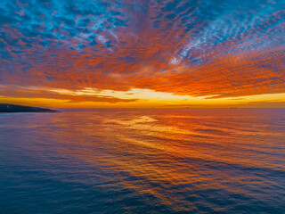 Obraz na płótnie Canvas Sunrise at the seaside with beautiful cloudcover
