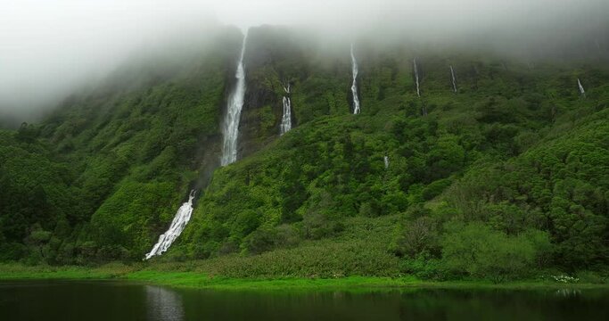 Flores island aerial view in Azores Ribeira do Ferreiro waterfalls in fog day