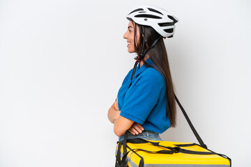 Young caucasian woman with thermal backpack isolated on white background in lateral position