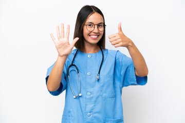 Young surgeon doctor woman isolated on white background counting six with fingers