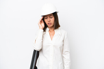 Young architect woman with helmet and holding blueprints isolated on white background with headache