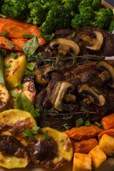 grilled vegetables with meat and mushrooms.