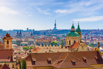 Panoramic view of Prague's cityscape with tens of towers mixing heritage and modernity 