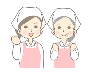 ガッツポーズする笑顔の女性調理スタッフ