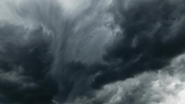 storm sky timelapse, dark dramatic clouds during thunderstorm, rain and wind, extreme weather, abstract background
