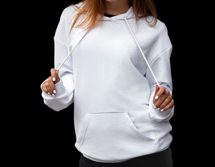 A young girl wears a white hoodie. No logo basic sportswear. Long sleeve sweatshirt mockup.