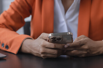 Close up of woman hands using smartphone, information online on smartphone for online shopping concept. 