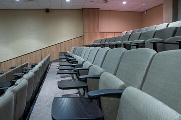 auditorium rows of empty chairs in a conference center