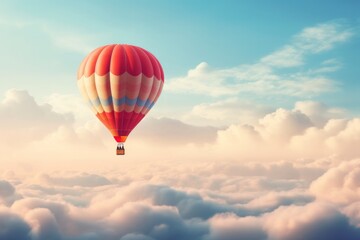 Hot air balloon heading towards the clouds in the sky.