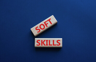 Soft skills symbol. Wooden blocks with words Soft skills. Beautiful deep blue background. Business and Soft skills concept. Copy space.