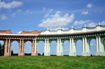 Fototapeta na wymiar Colonnade of the Ruzhany palace complex of the Belarusian magnates Sapieha after and before restoration.