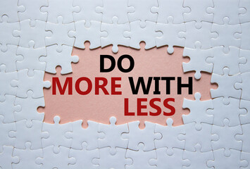 Do more with less symbol. Concept words Do more with less on white puzzle. Beautiful pink background. Business and Do more with less concept. Copy space.