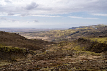 Reykjadalur Valley Cliff lookout over South Iceland and Hveragerdi City from above during daytime in the Early summer.