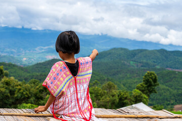 Pakhayo girl looking to beautiful rice terraces. Ban Pa Bong Piang That has the most beautiful rice terraces in Thailand.