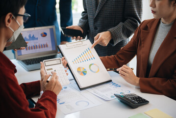 Business people meeting at office writing notes about sticky notes Laptop,tablet  Planning and Brainstorming Strategies of Colleagues