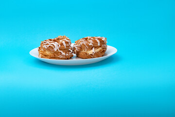 Food, donuts, sweets, custard, on a clean background, blue, banner, peach, pastries, decorative pastries, sweet, tasty, on a plate, on a plate