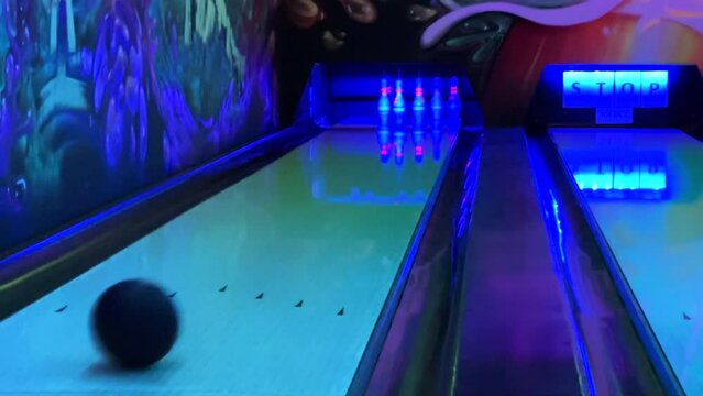Bowling. View of the bowling alley and the moving ball