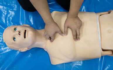 First aid CPR training chest pumping.