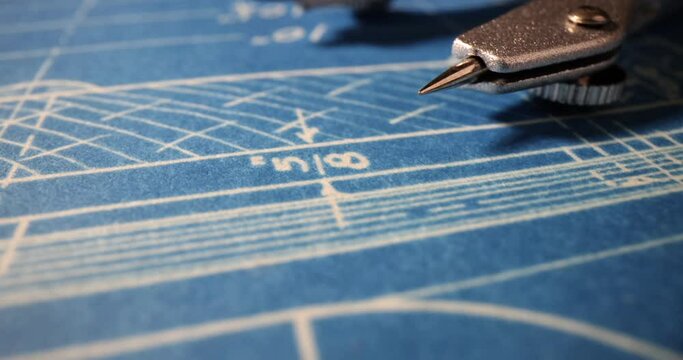 Engineering blueprint of buildings with blue architectural tools and compasses. Objects for sketching and work