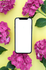 Blank phone screen mockup for digital invitation, design, 
presentation, flat lay with pink  hydrangea flowers, smartphone template for electronic card. . Top view, copy space for text, product place.