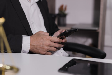 Male lawyer working with contract at desk, justice and law concept.