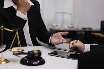 Male lawyer working with contract at desk, justice and law concept.