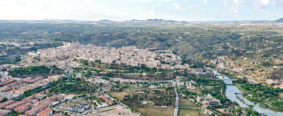 Panoramic from a hot air balloon of the north face of the city of Toledo Spain with the Tagus River