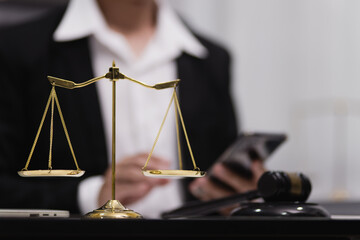 Male lawyer working with contract at desk, justice and law concept.