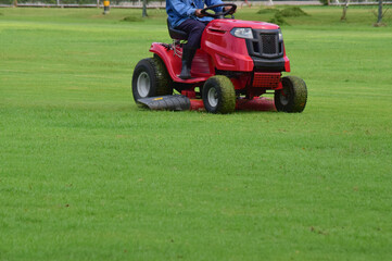 On the football field there is a lawn mower.