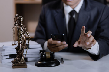 Asian lawyer working with contract at desk, justice and law concept.