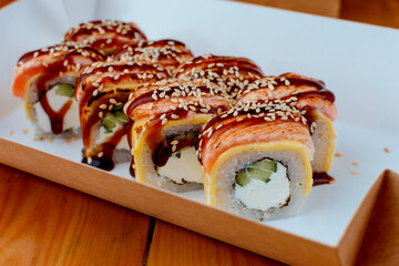 rice sushi with painted fish and tender cheese