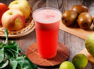 Fresh watermelon juice with raw fruits served in glass isolated on table top view of morning vitamins drink