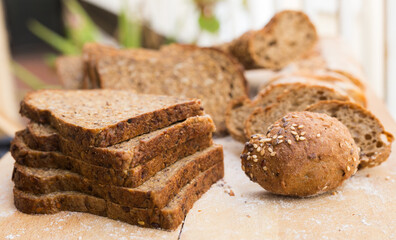 fresh loaf of bread on wooden board