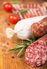 Smoked sausage with rosemary and peppercorns tomatoes and garlic